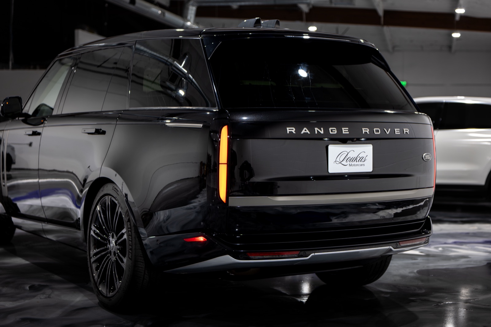 A Range Rover wearing a Loukas Motorcars plate in the studio